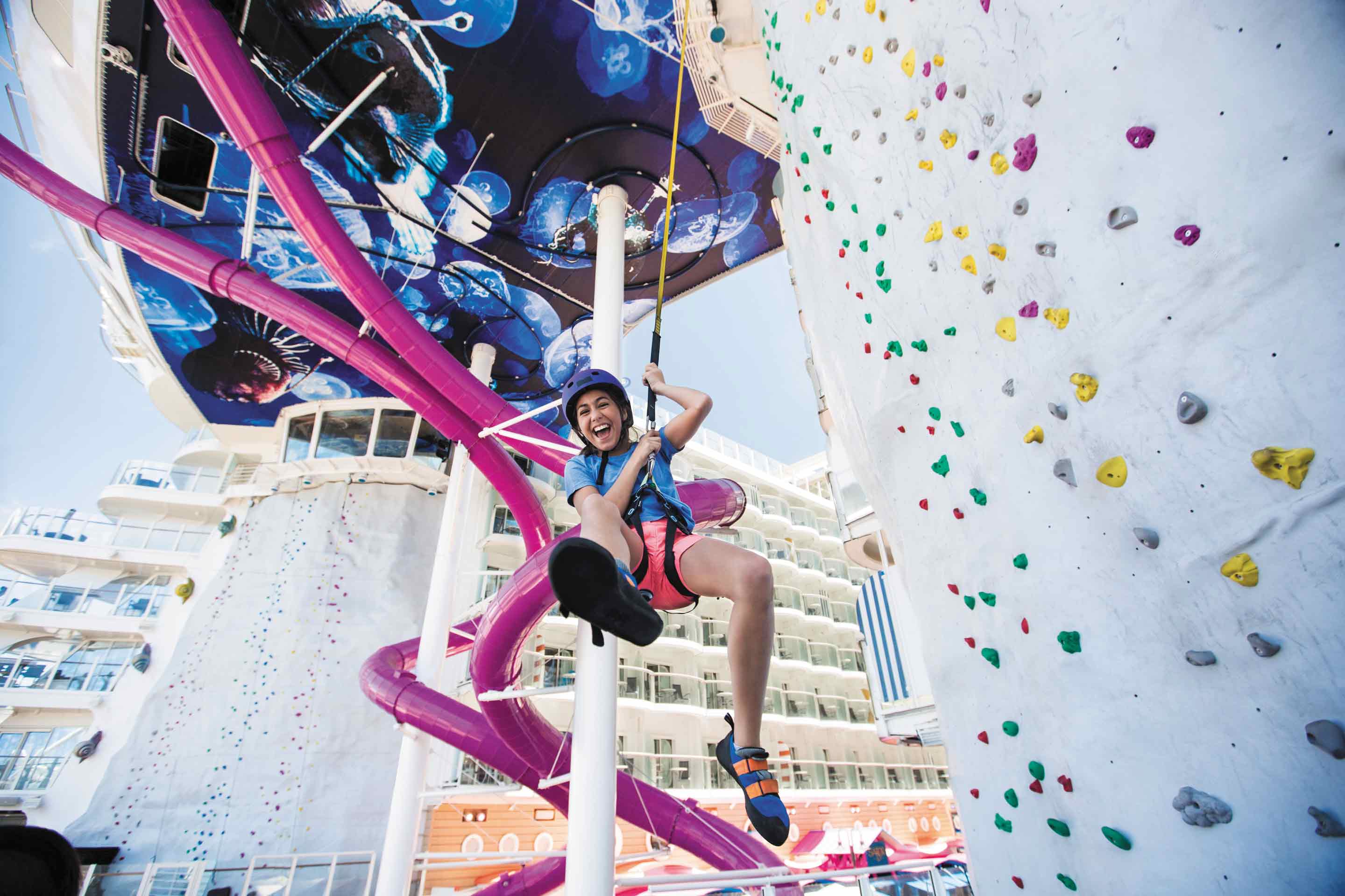 Girl sliding down the Rock Climbing wall