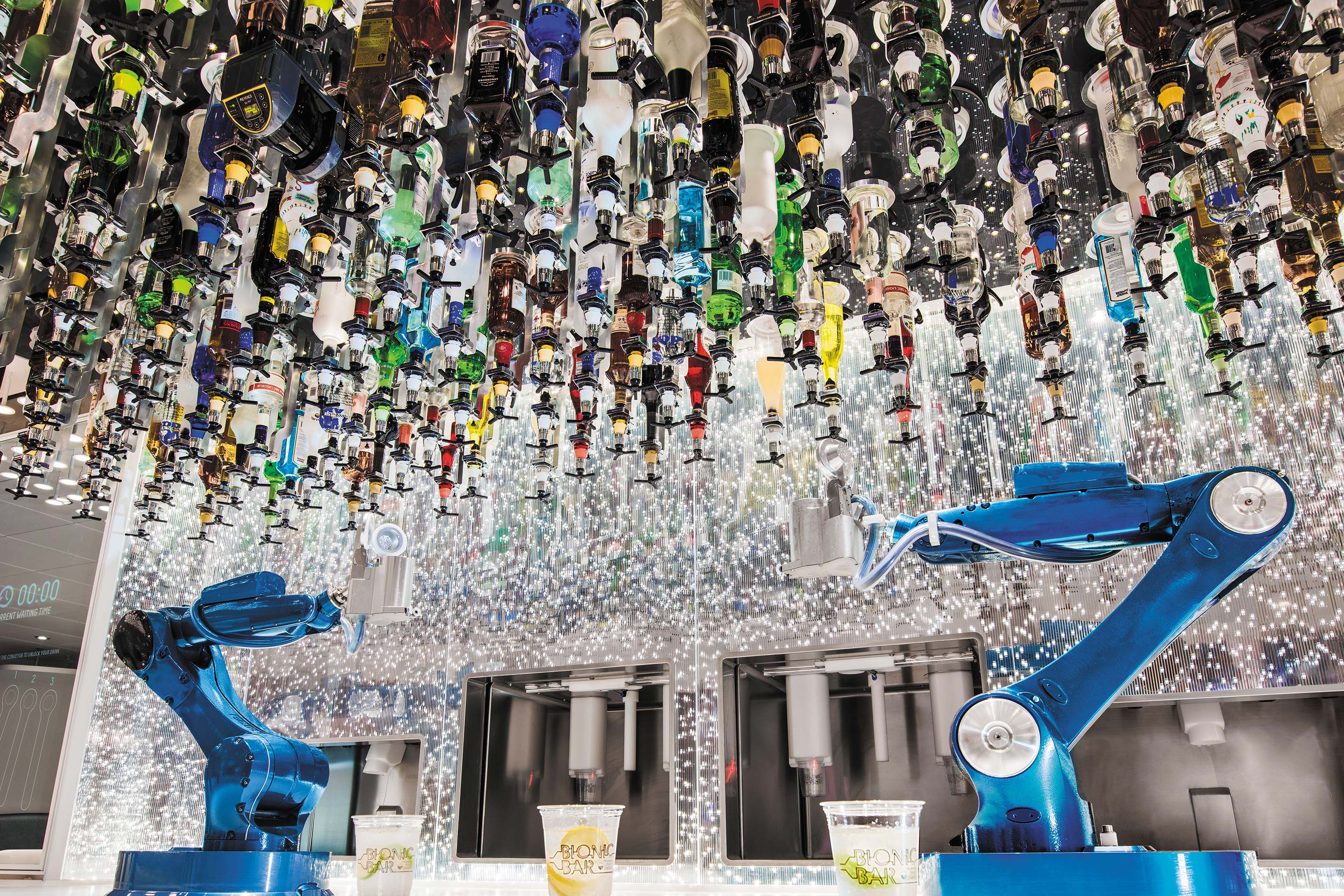 Bionic bartender mixing and serving cocktails.